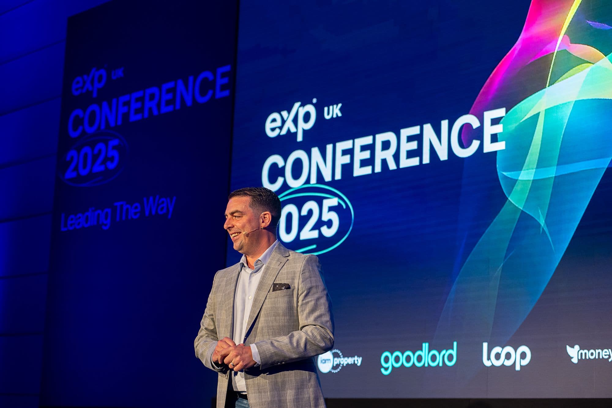 Adam Day speaking at eXp UK Conference 2025